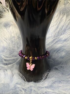 Purple Beaded Bracelet with Pink Butterfly Charm